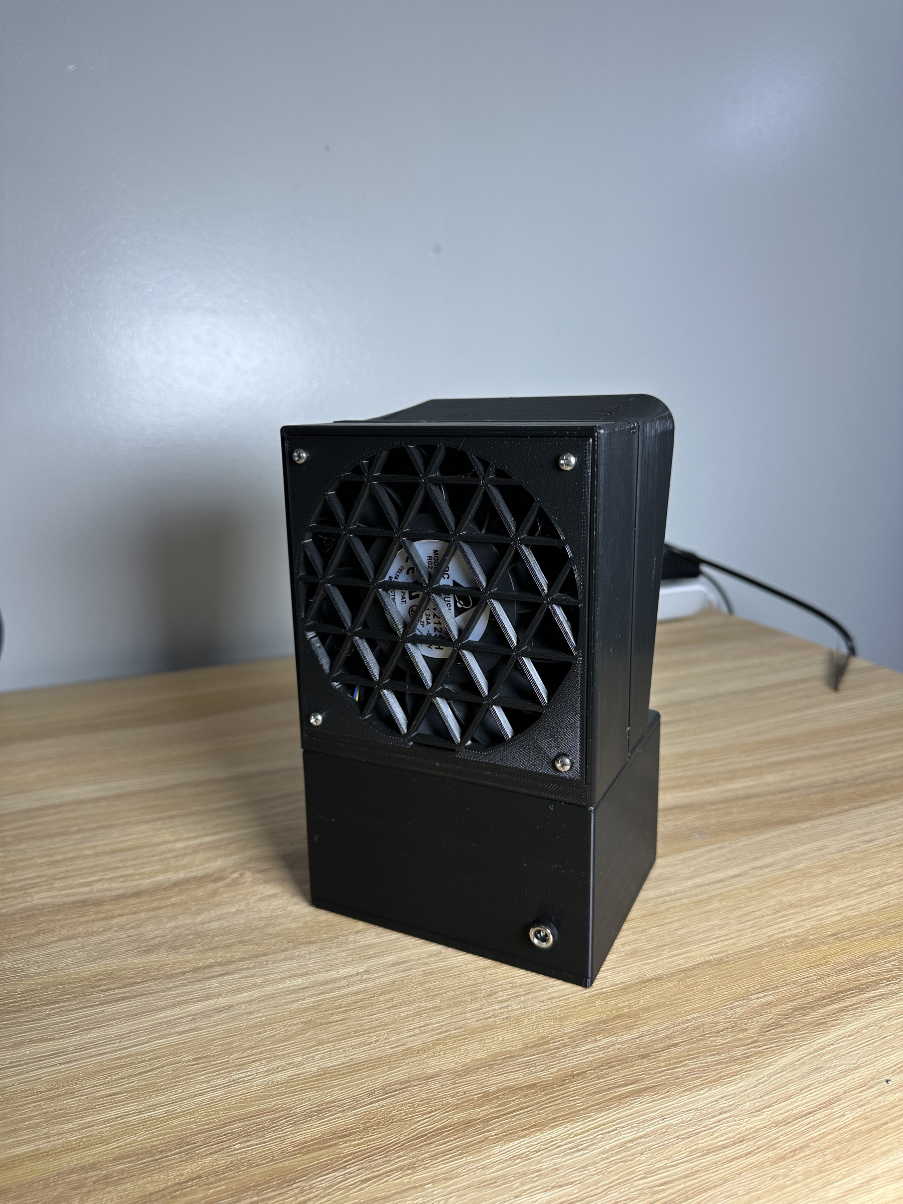 Back of the fume extractor, showing the 120 mm fan behind a printed grille