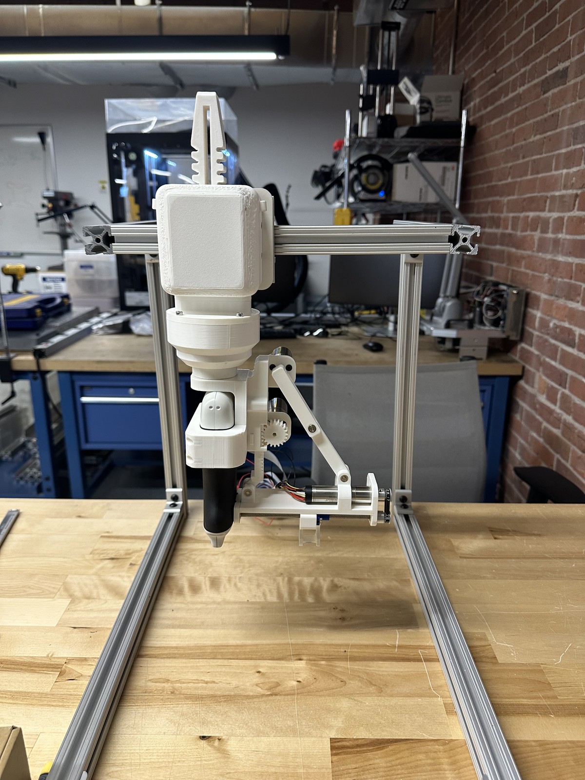 The needle cannulation fixture mounted on an aluminum extrusion frame