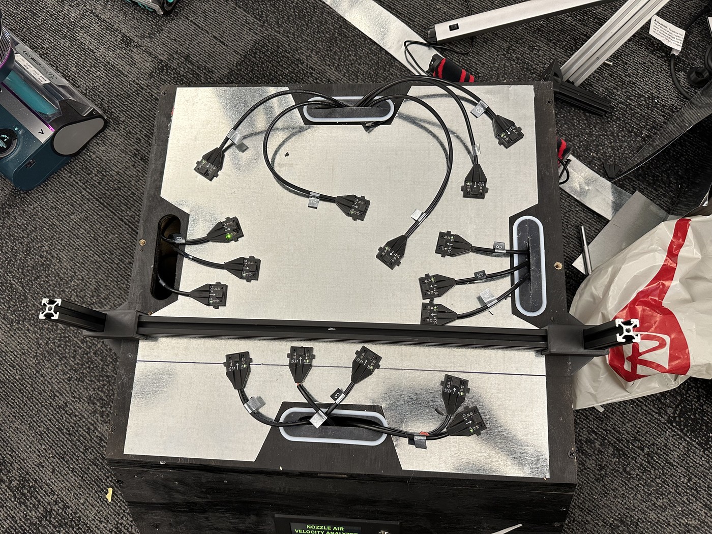 Top view of the sensor plate with the airflow sensors around the nozzle opening